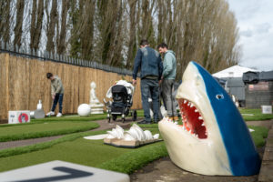 Mini golf hire - an image of a portable mini golf course with a shark head prop