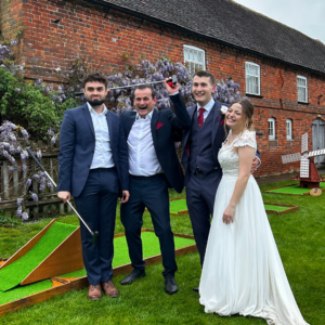 Bridge and groom at a wedding alongside two other guests