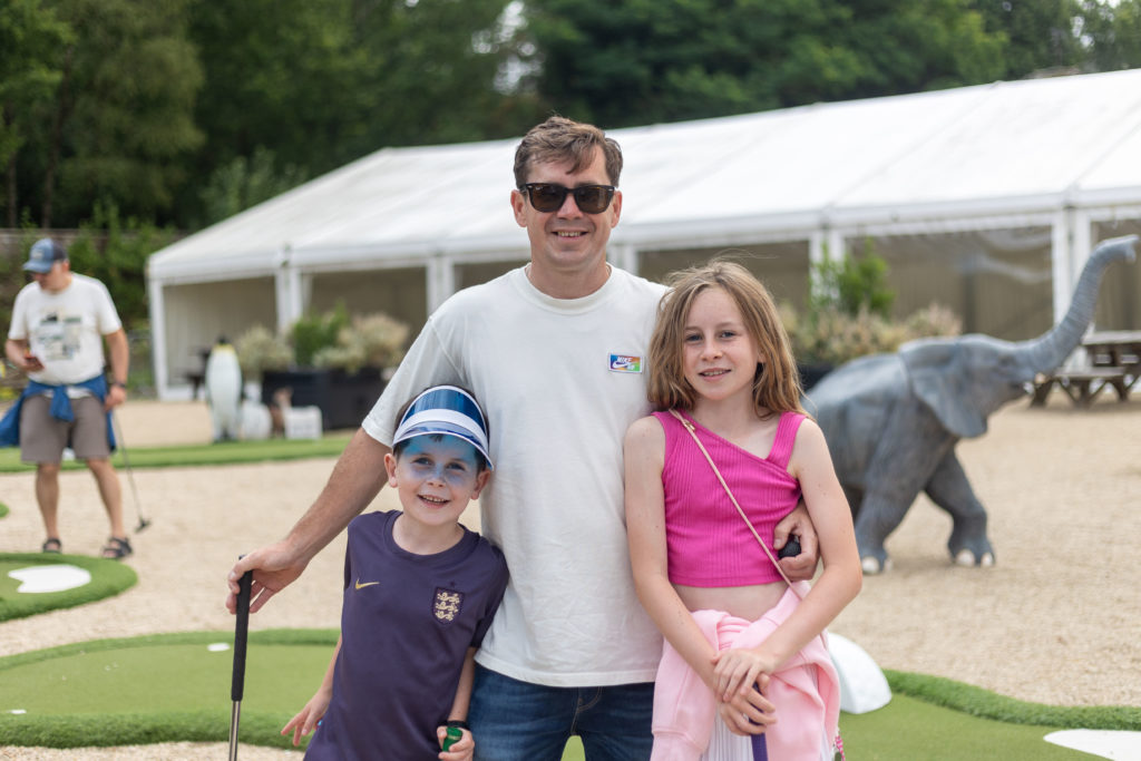 Man and his daughter and son posing for the camera