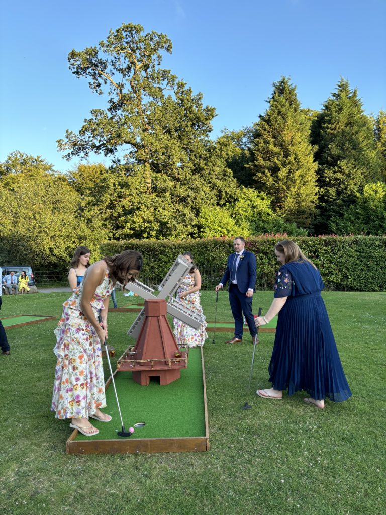 Ladies playing mini golf