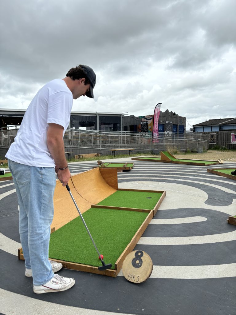 Man playing crazy golf