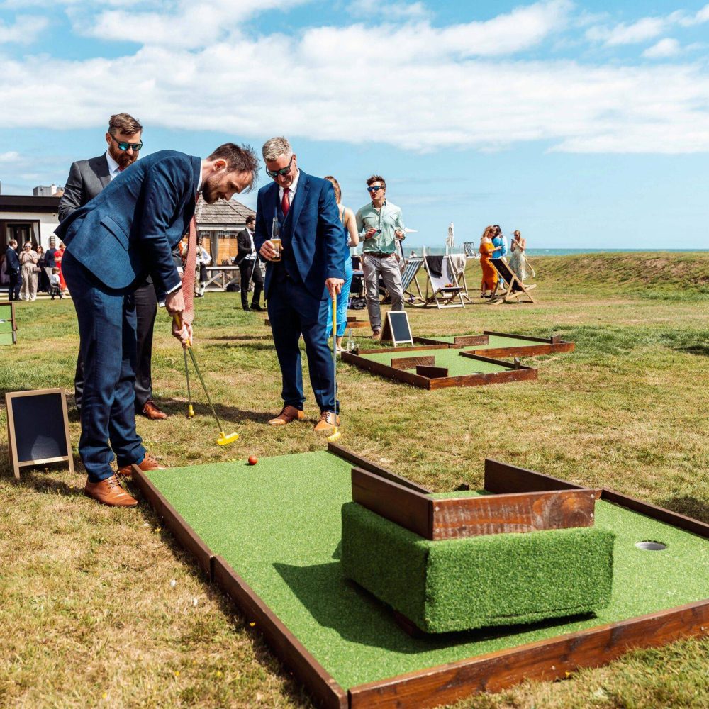 Mini golf at outdoor wedding on seafront