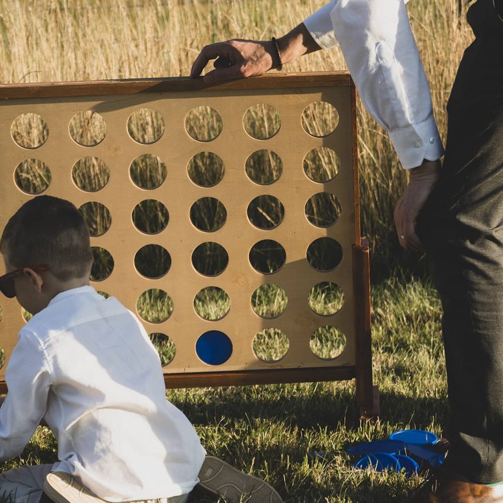 Boy playing giant connect 4